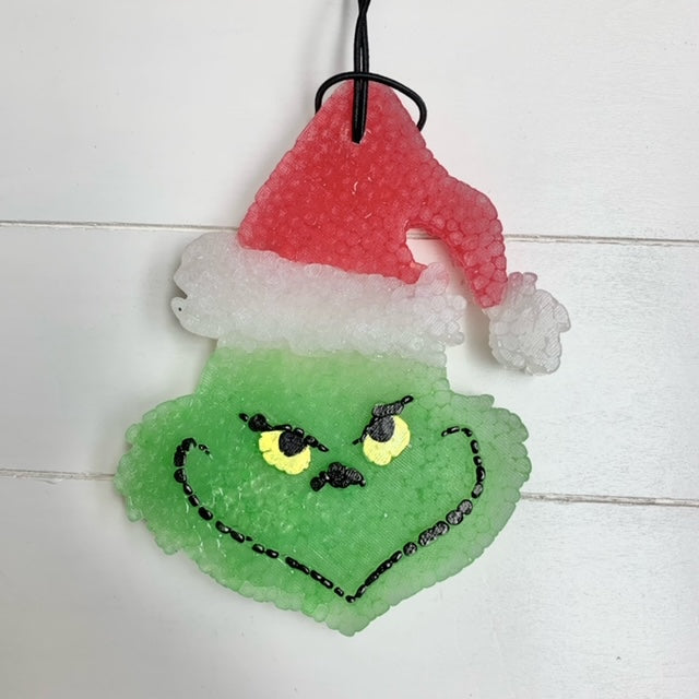 Wassail scent red hat grinch